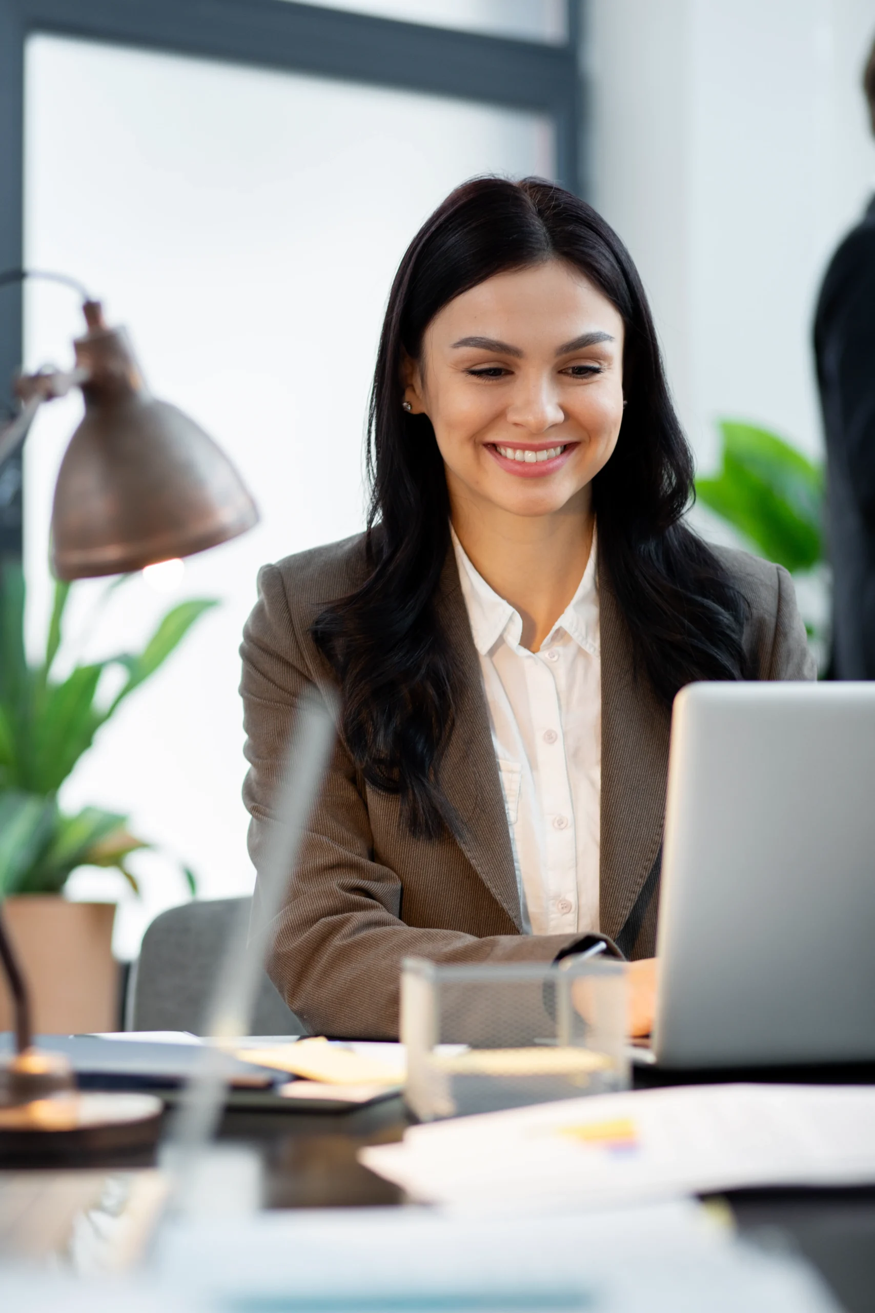 Close up smiley woman working laptop