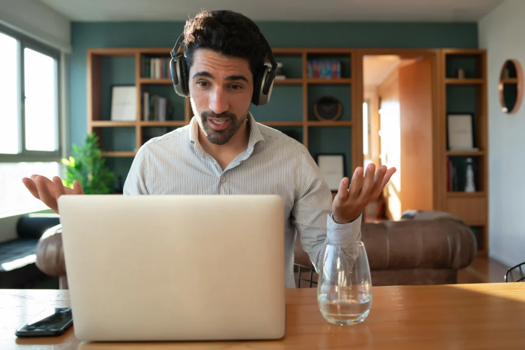 Portrait young man work video call with laptop from home home office concept new normal lifestyle